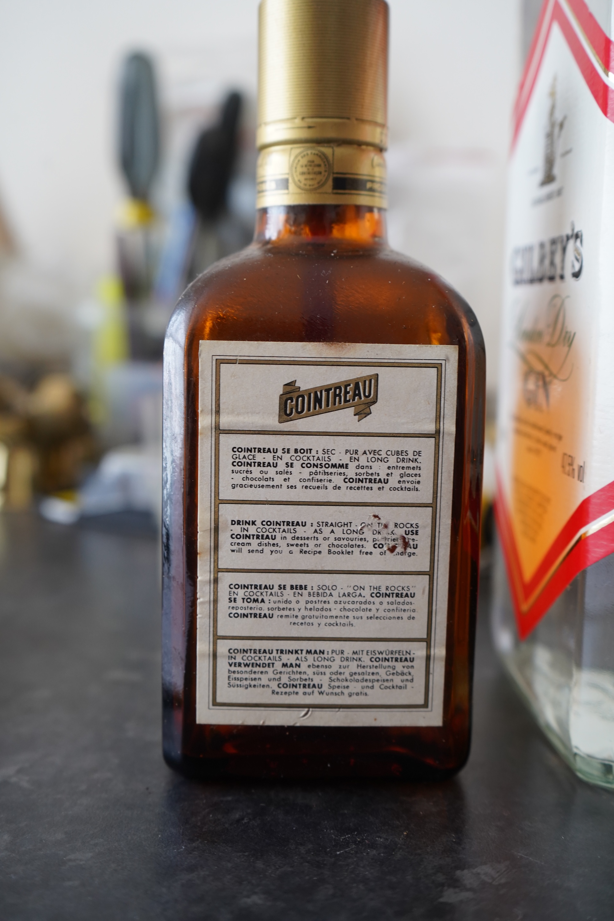 Six bottles of spirits and liqueurs, including whiskey and gin